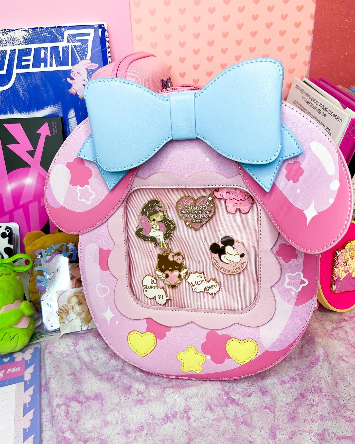 Cute Kitty and Friends Ita Bag and Enamel Pins in hand
