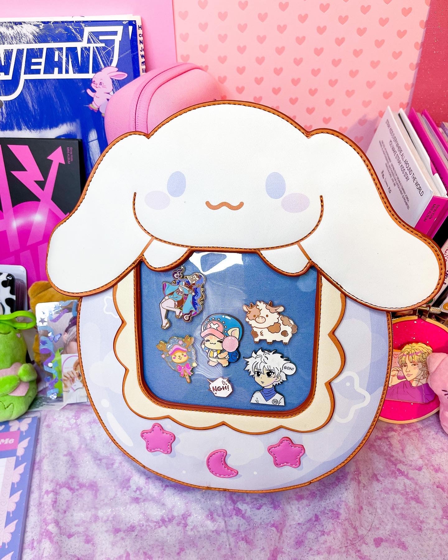 Cute Kitty and Friends Ita Bag and Enamel Pins in hand